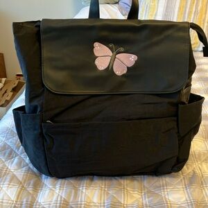 On the go backpack by Thirty-One. New in bag. Butterfly embroidered on flap